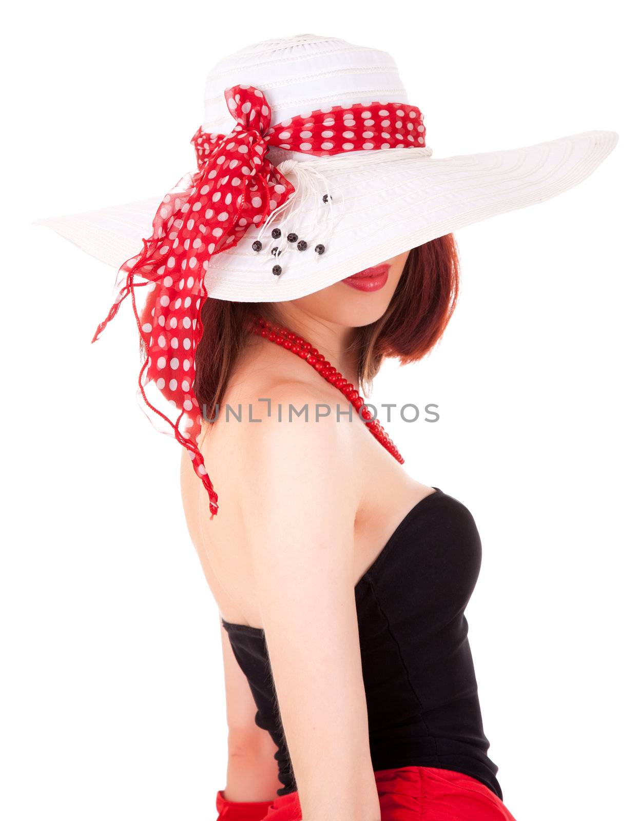 Fashion girl in retro style with bright make-up and big hat on white background