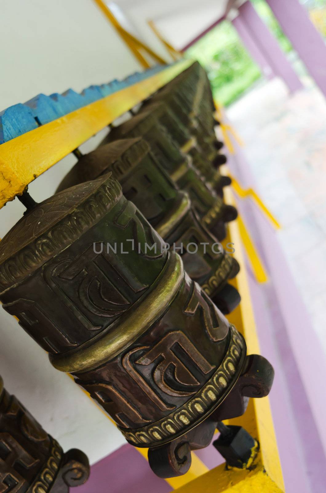 Prayer wheels in a row by iryna_rasko