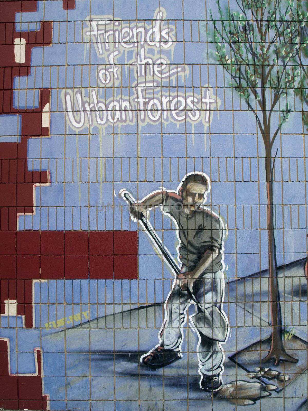 "Friends of the urban forrest" text on a graffiti
