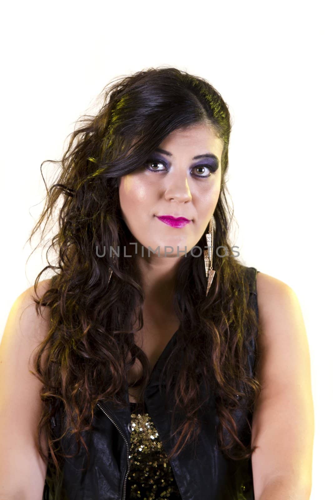 View of a beautiful girl in dark leather clothes against a white background.