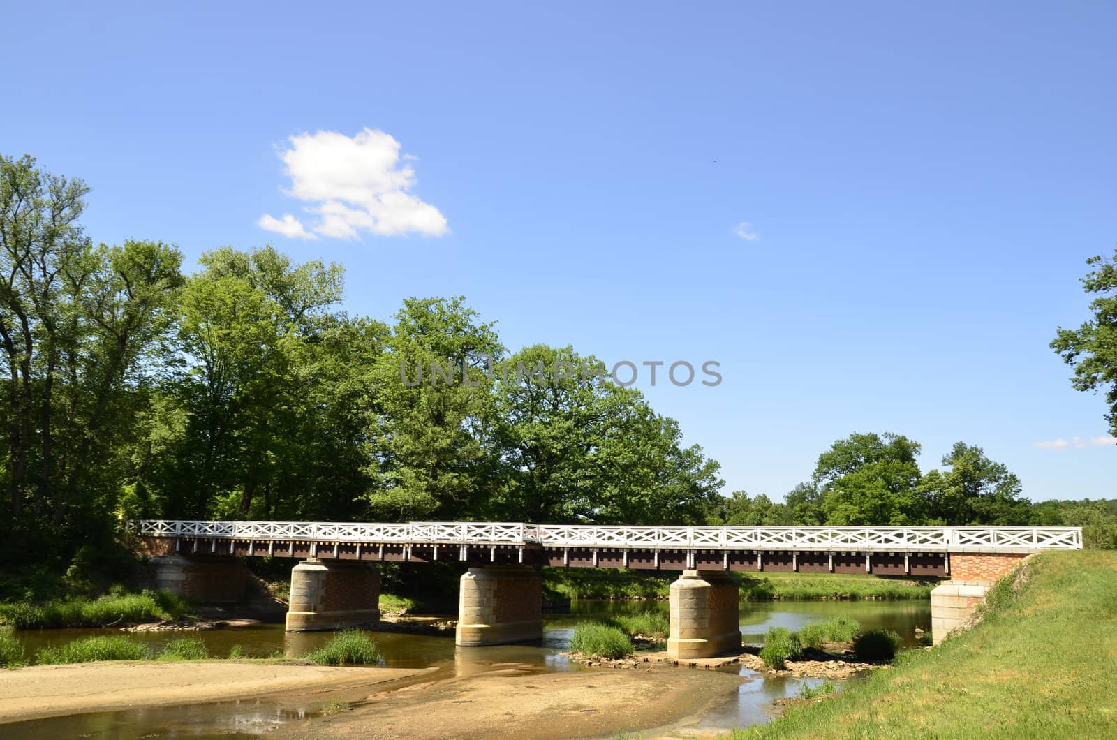 This photo present Bad Muskau - double bridge on the river Neisse.