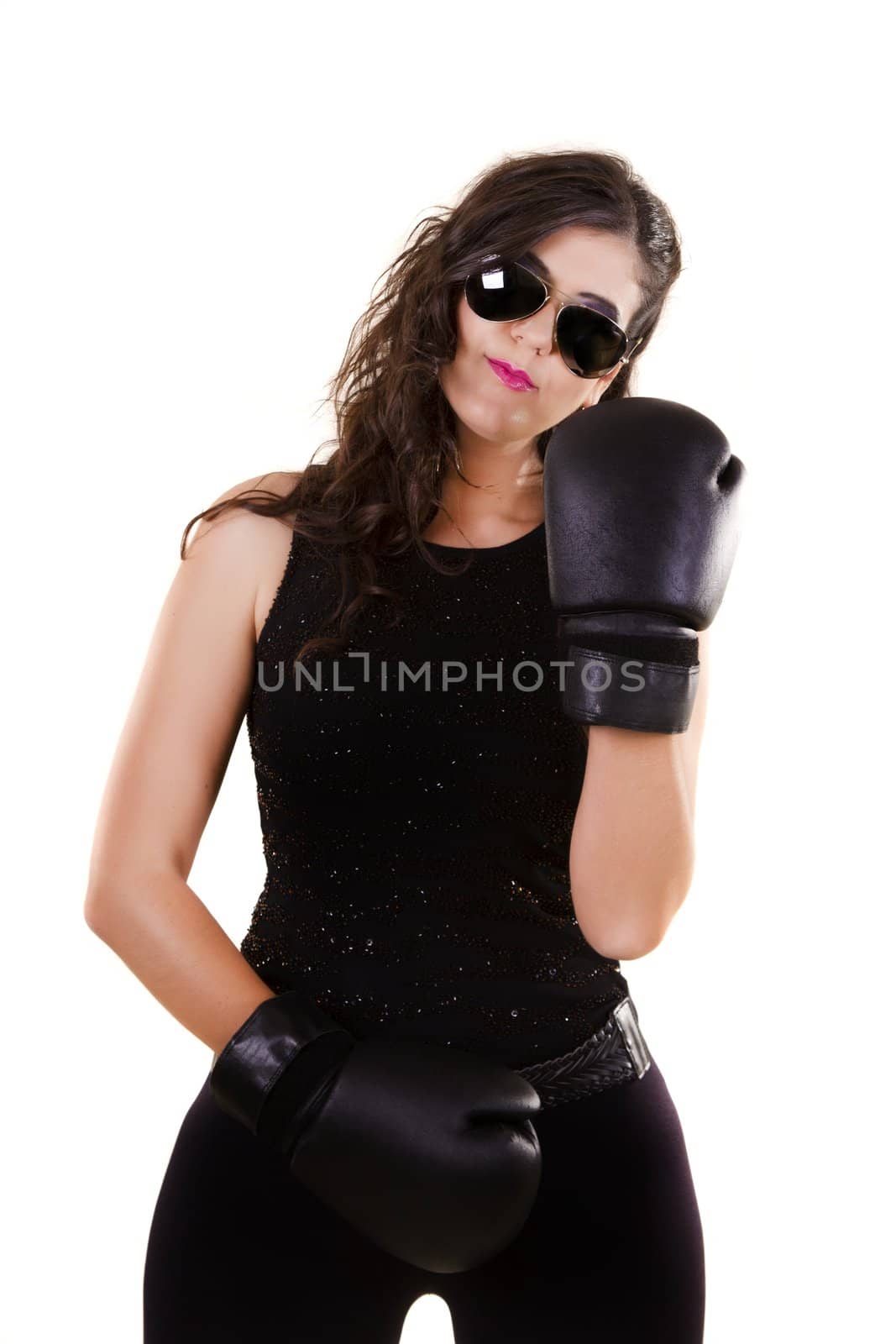 View of a beautiful girl in dark leather clothes against a white background with boxing gloves.