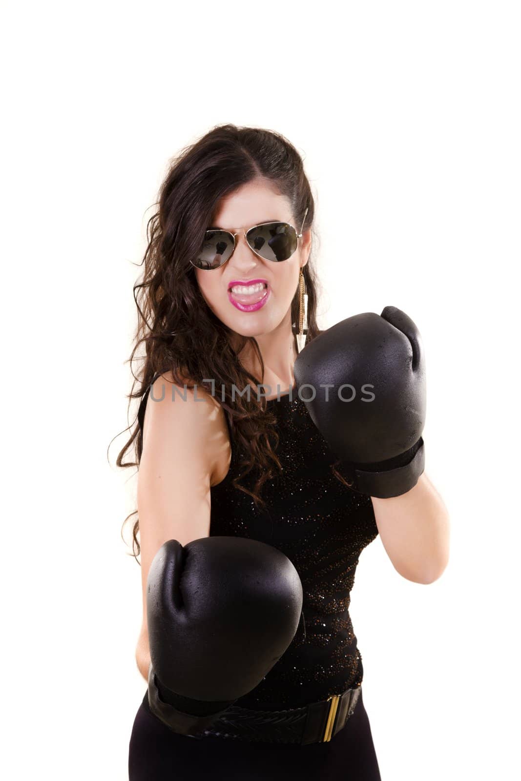 View of a beautiful girl in dark leather clothes against a white background with boxing gloves.