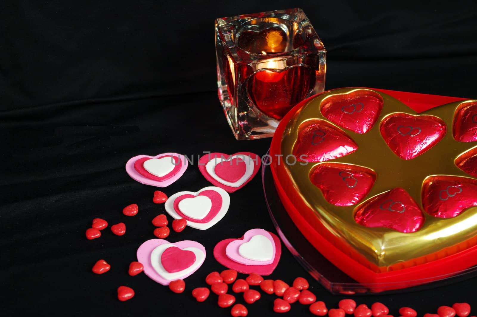 A Valentines Day background with  Hearts candle and candy