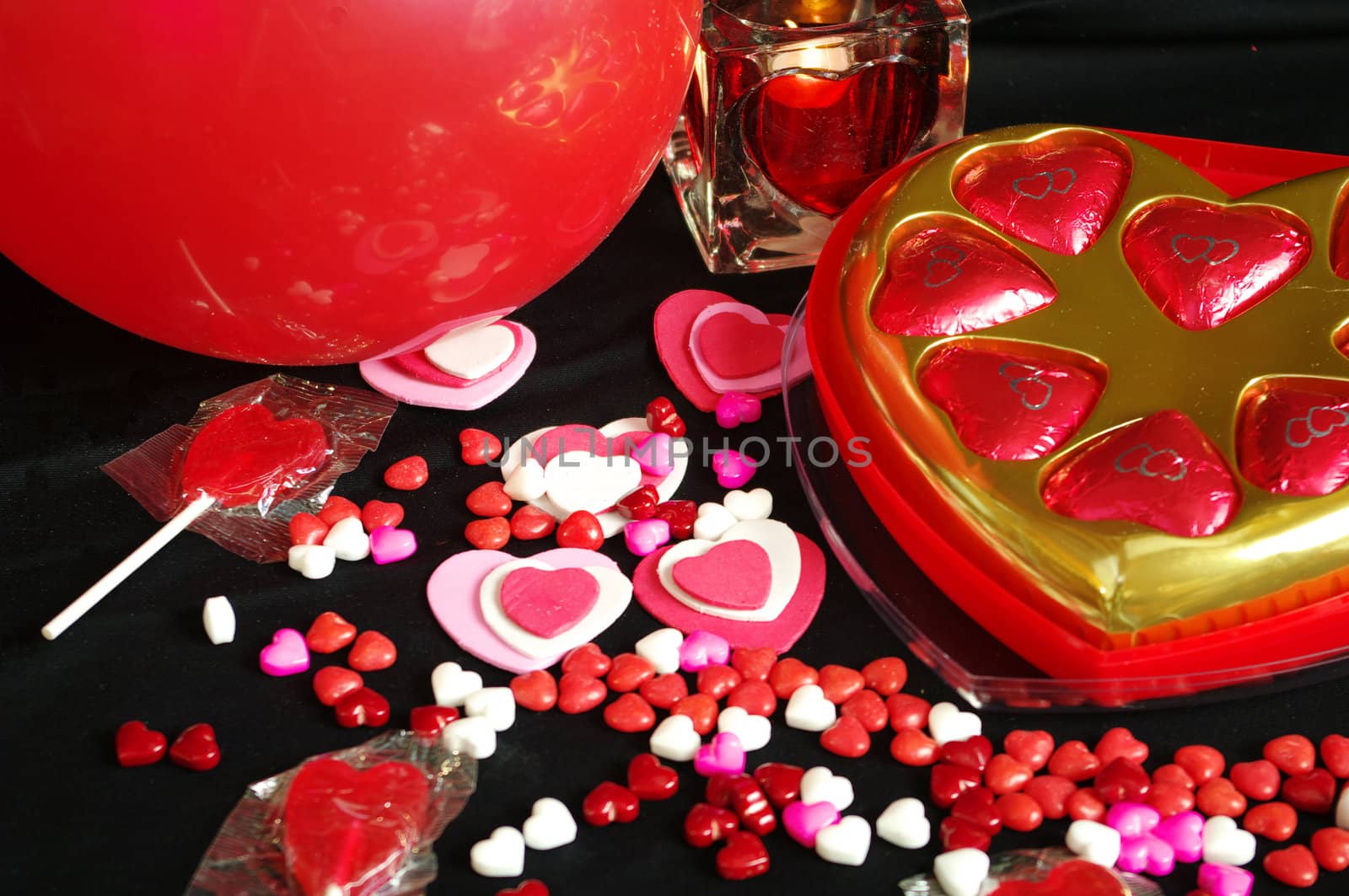 A Valentines Day Background with Candy Candle Hearts Balloon 