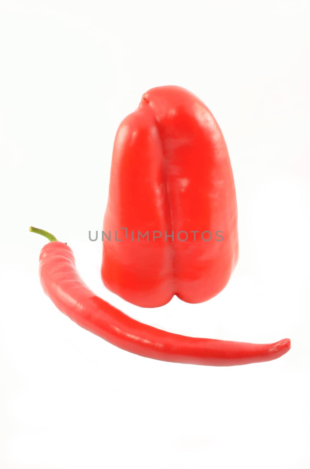 Sweet and sharp peppers on the isolated white background