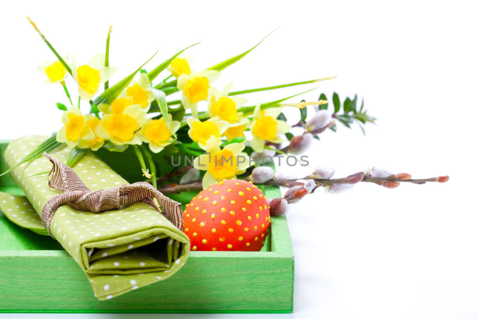 Easter egg with a serviette, in a tray for breakfast. isolated on white background.