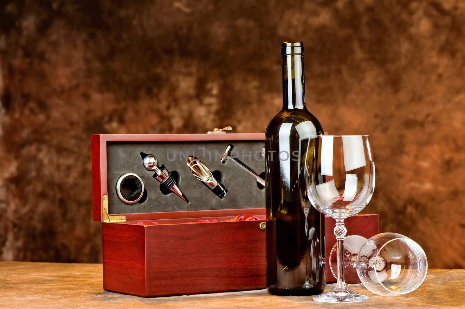 Composition of wine bottle and two wine glasses