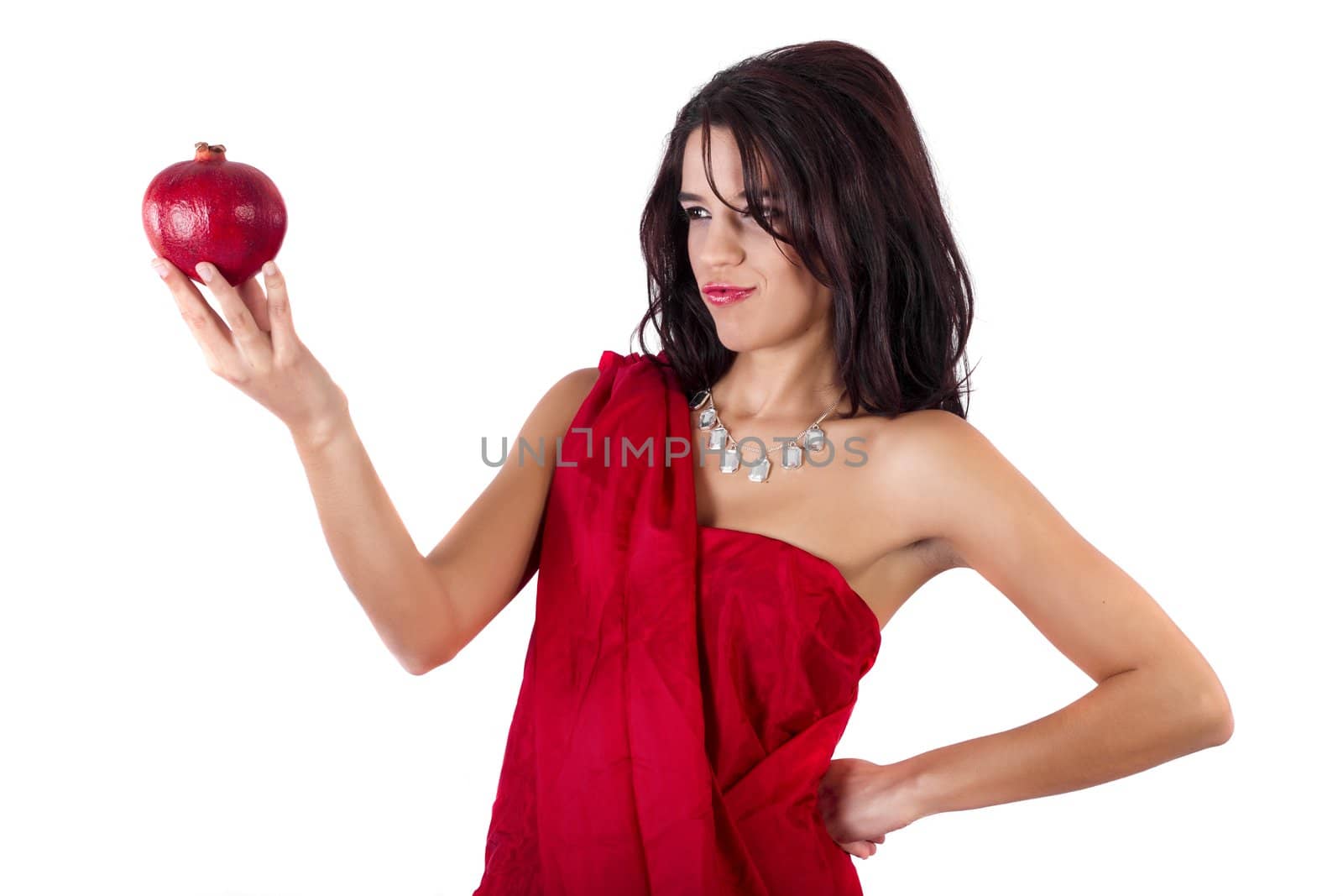 View of a beautiful girl holding a pomegranate.