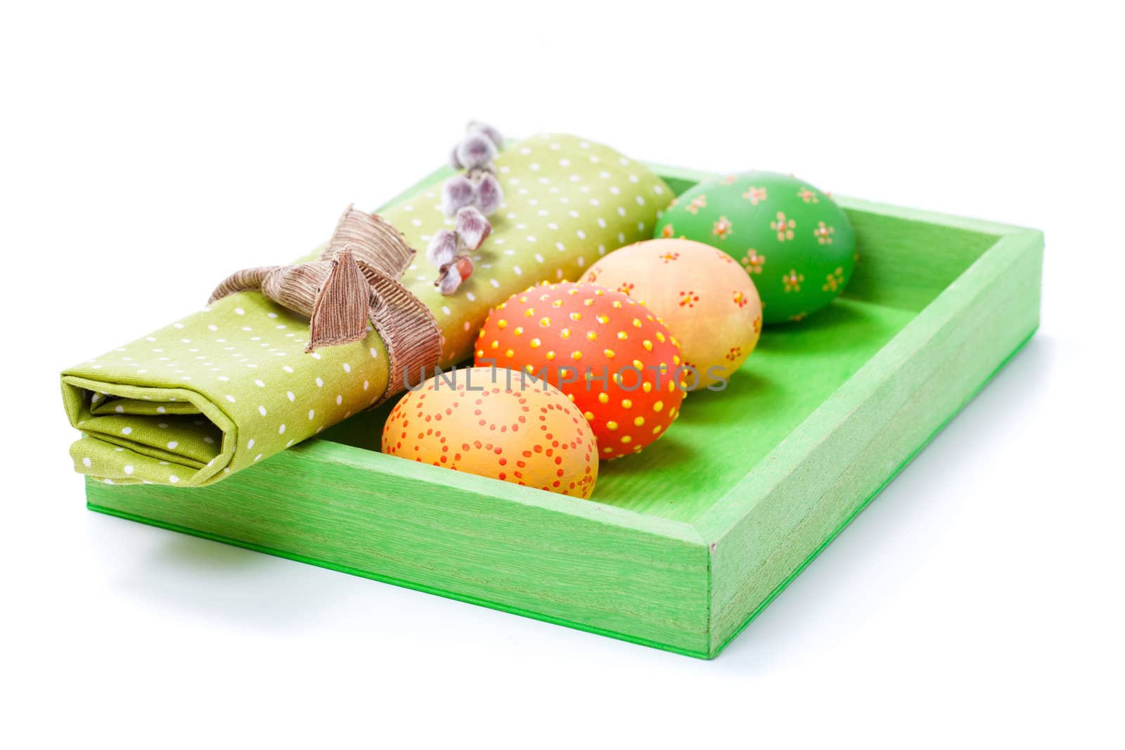 Easter egg with a serviette, in a tray for breakfast. isolated on white background.