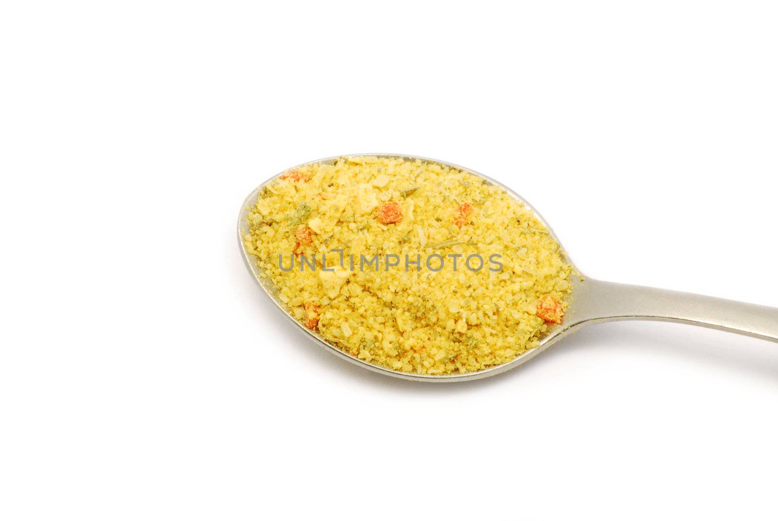 Spices on a silver spoon on white background