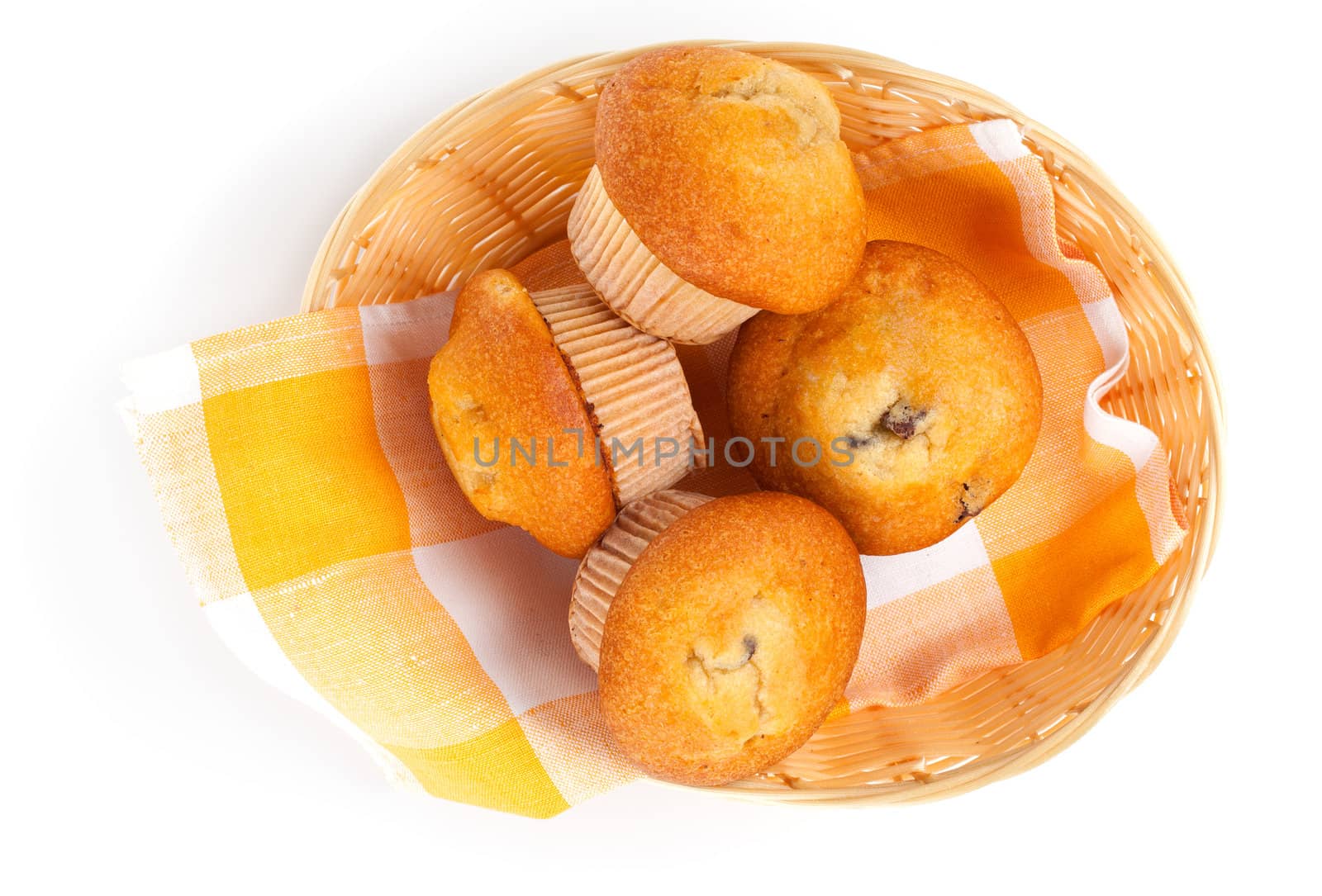 Muffins in a basket isolated on white background