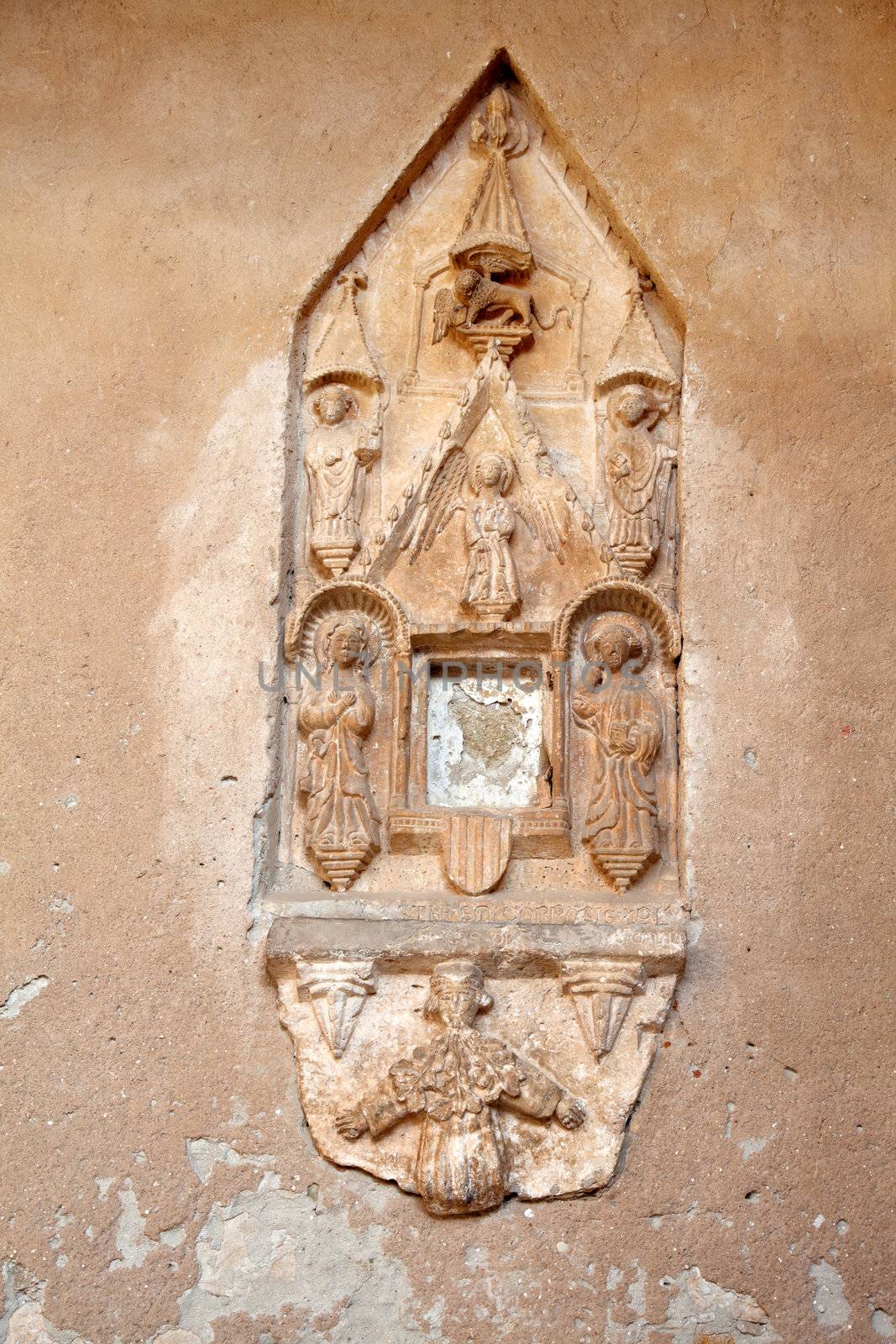religious stone carving, on the wall