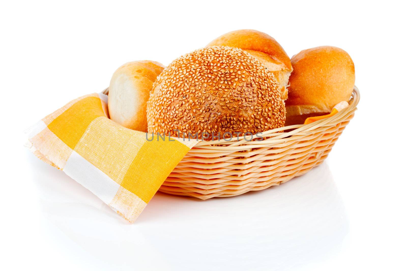 fresh baked buns in a basket on white background