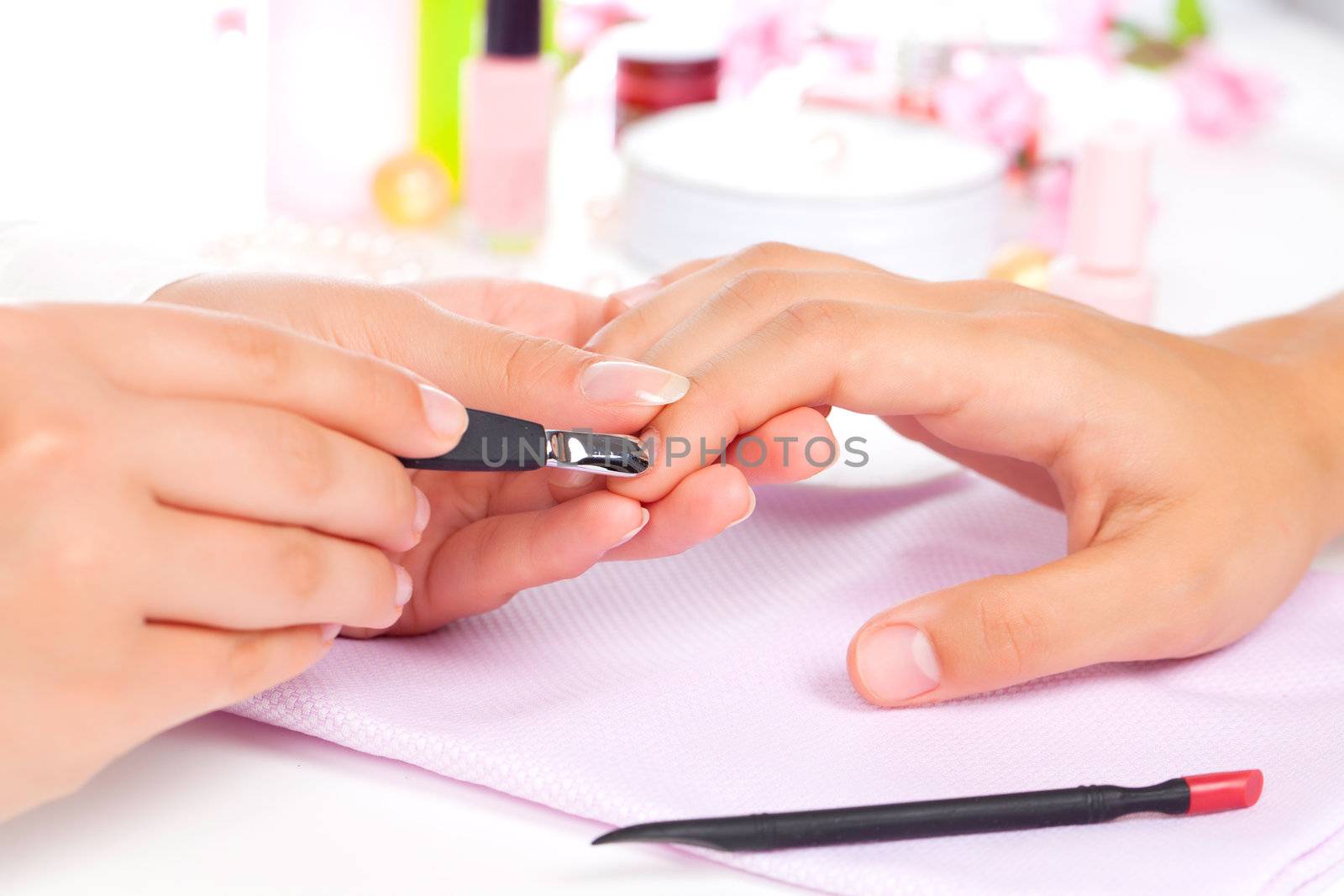 Manicure. Care of fingers of hands, cleaning, covering a varnish of nails.