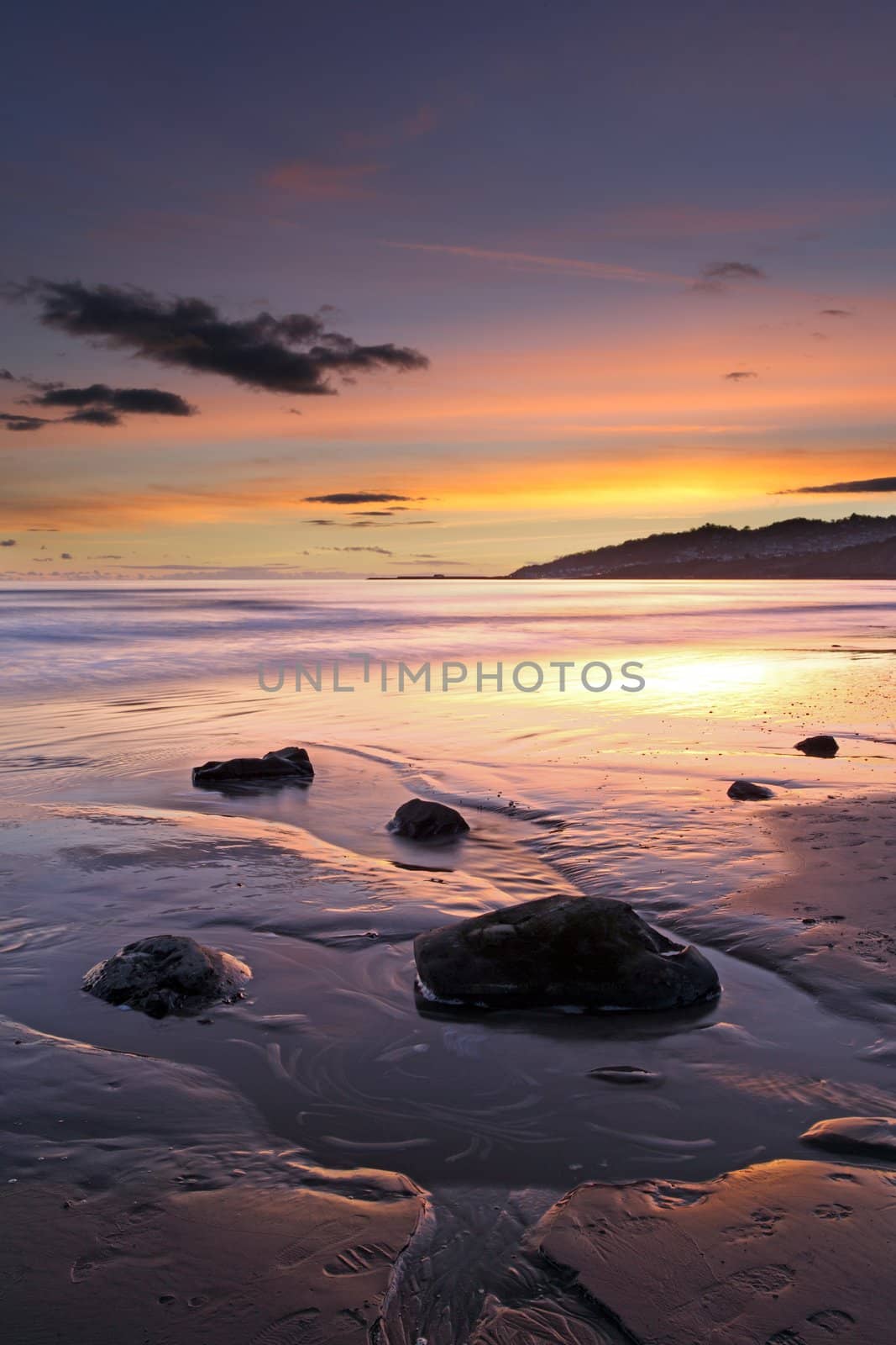 Charmouth beach at sunset looking toward lyme regis