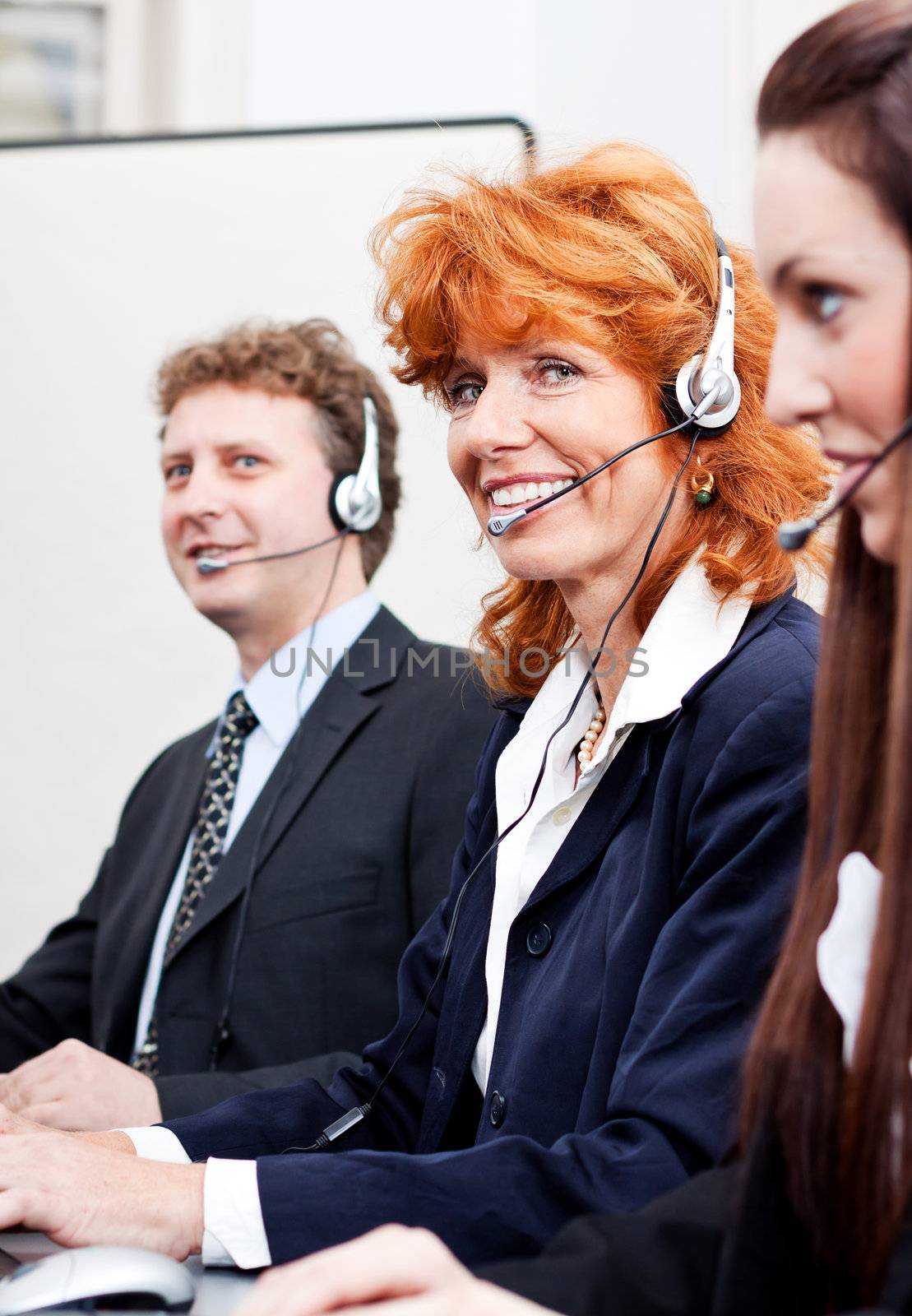 callcenter team business people with headphone at work in office