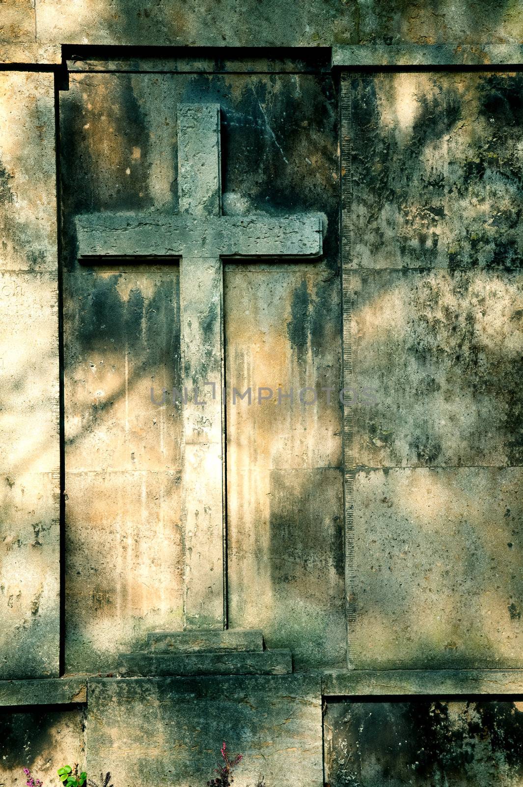 cross on wall background by motorolka