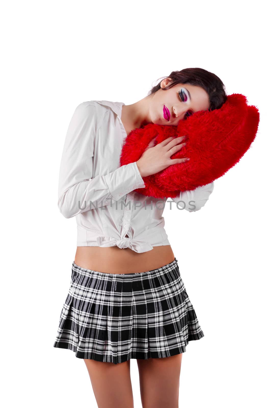 View of a beautiful girl with a red heart in a white background.