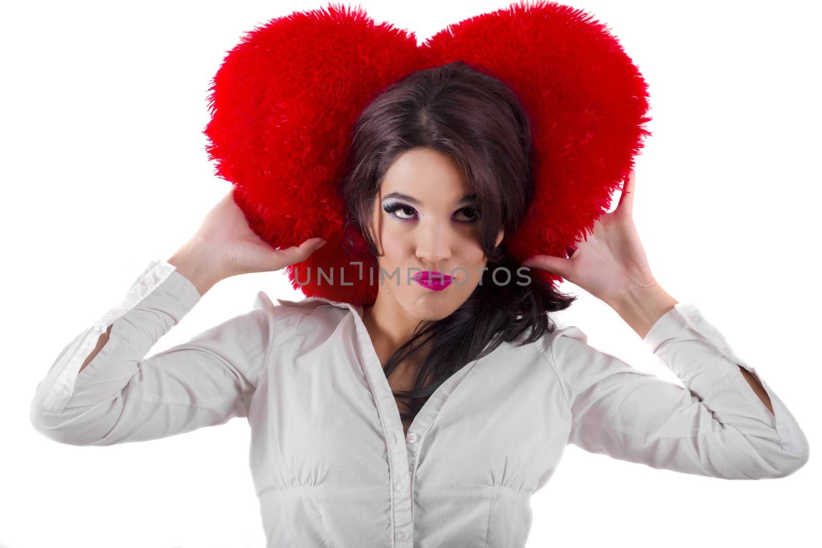 View of a beautiful girl with a red heart in a white background.