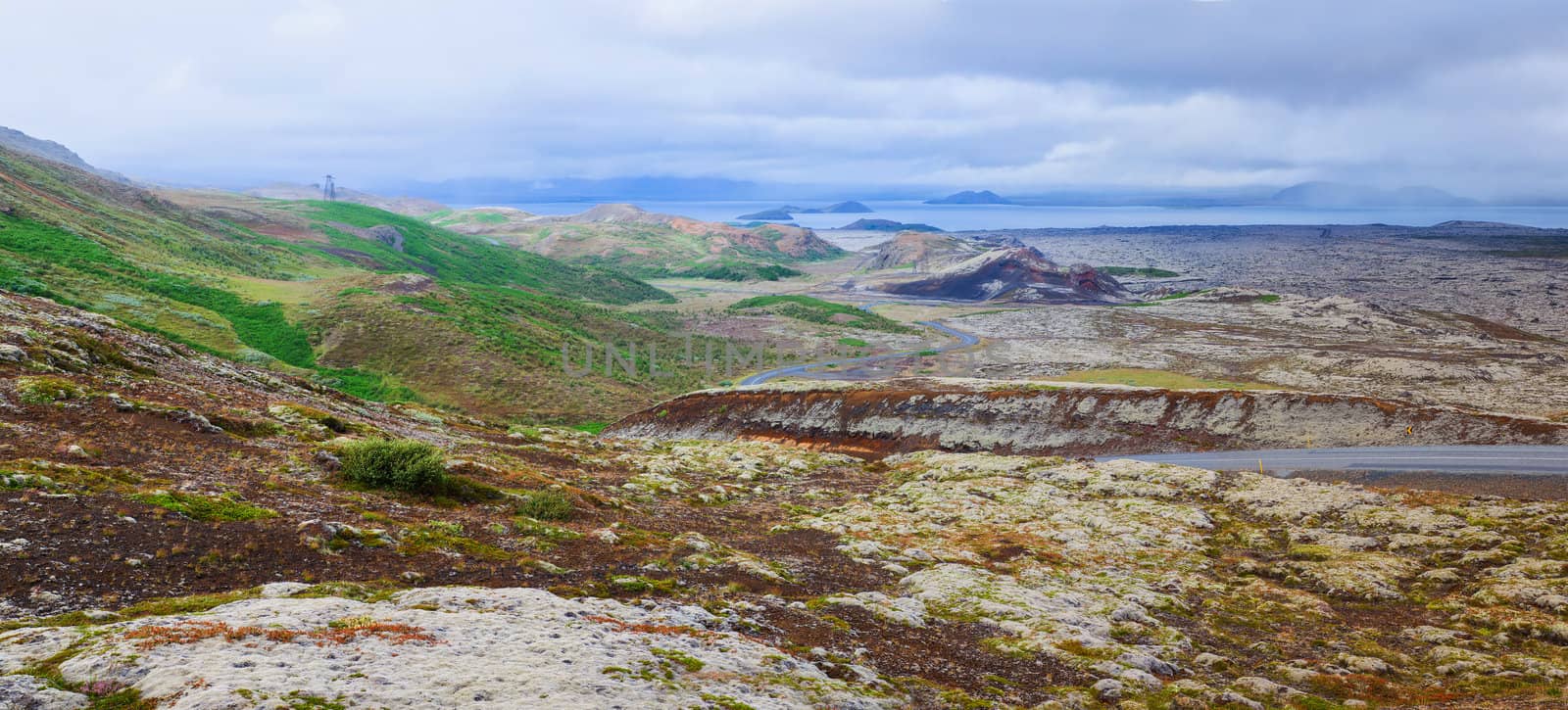 Icelandic landscape with mountains and the road. Nature reserve on the background, Iceland