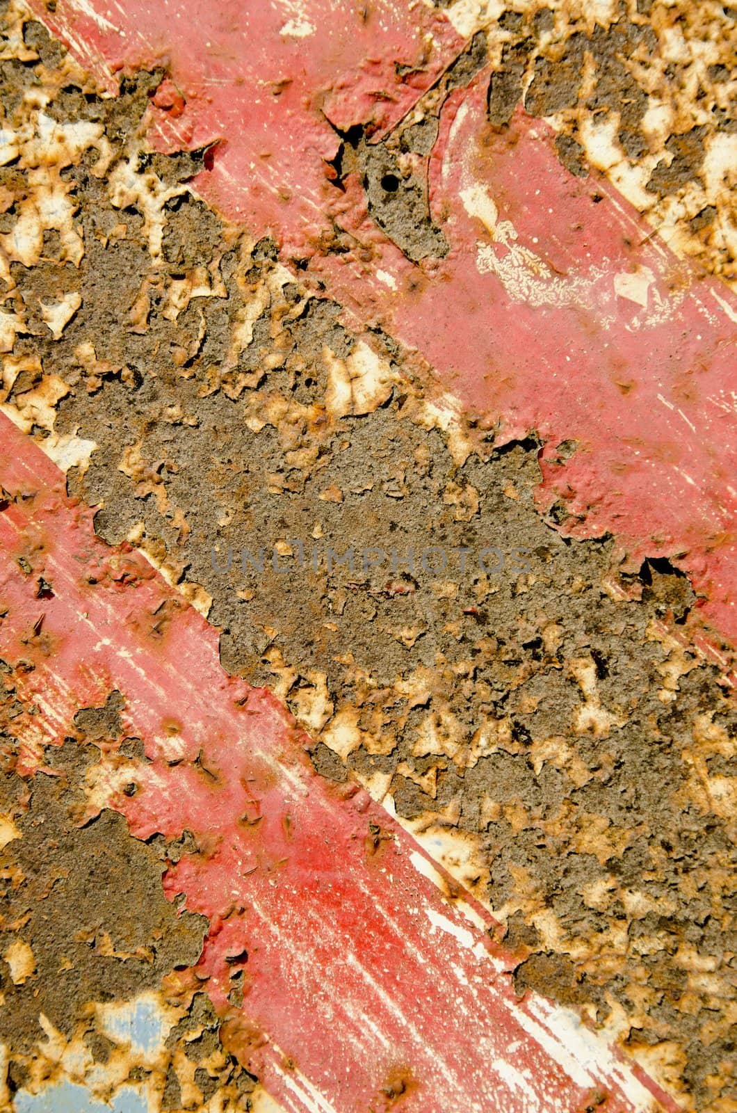 Rusty red painted metal road sign fragment. Interesting background.