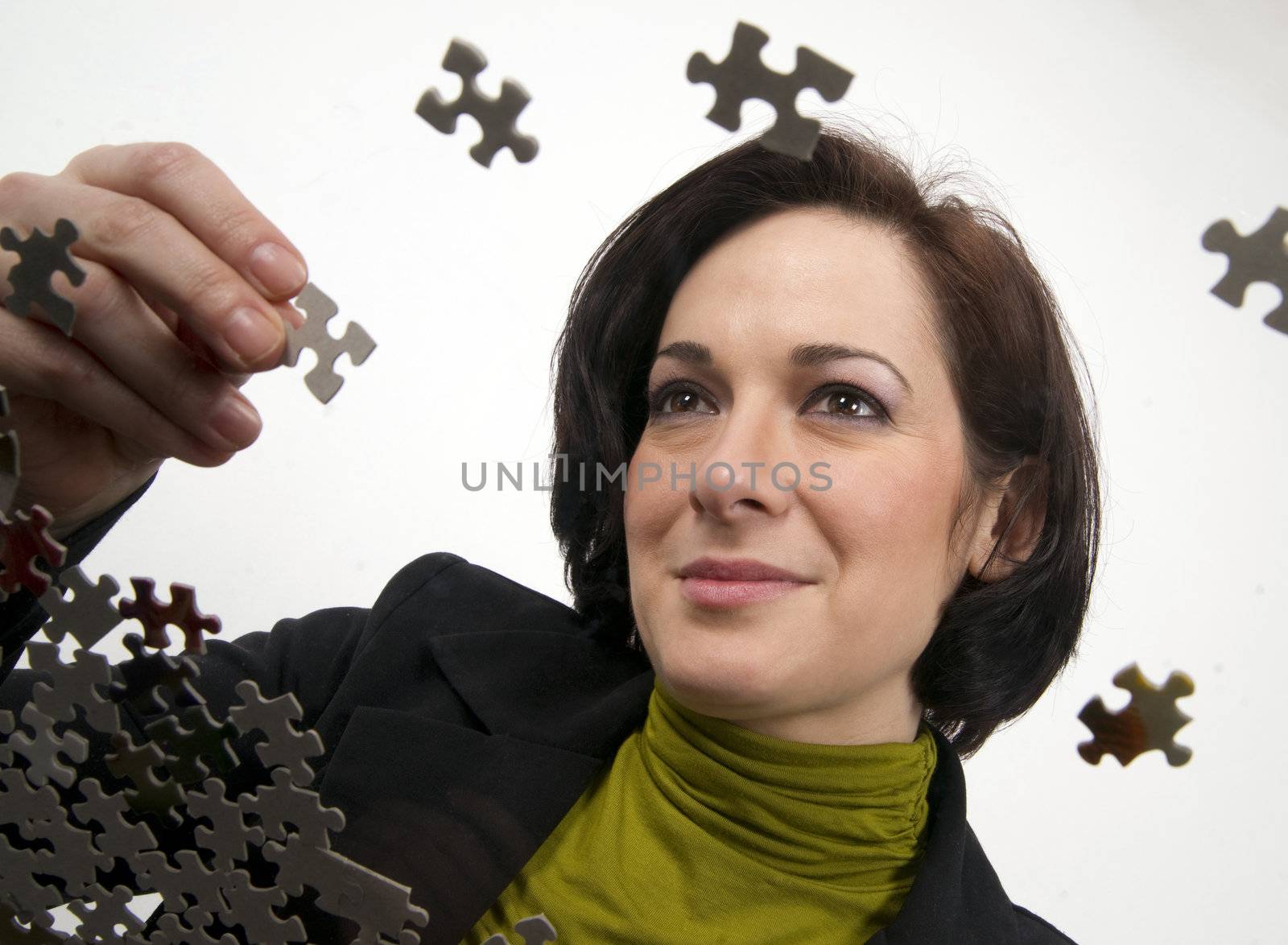 Female holding a piece of the puzzle