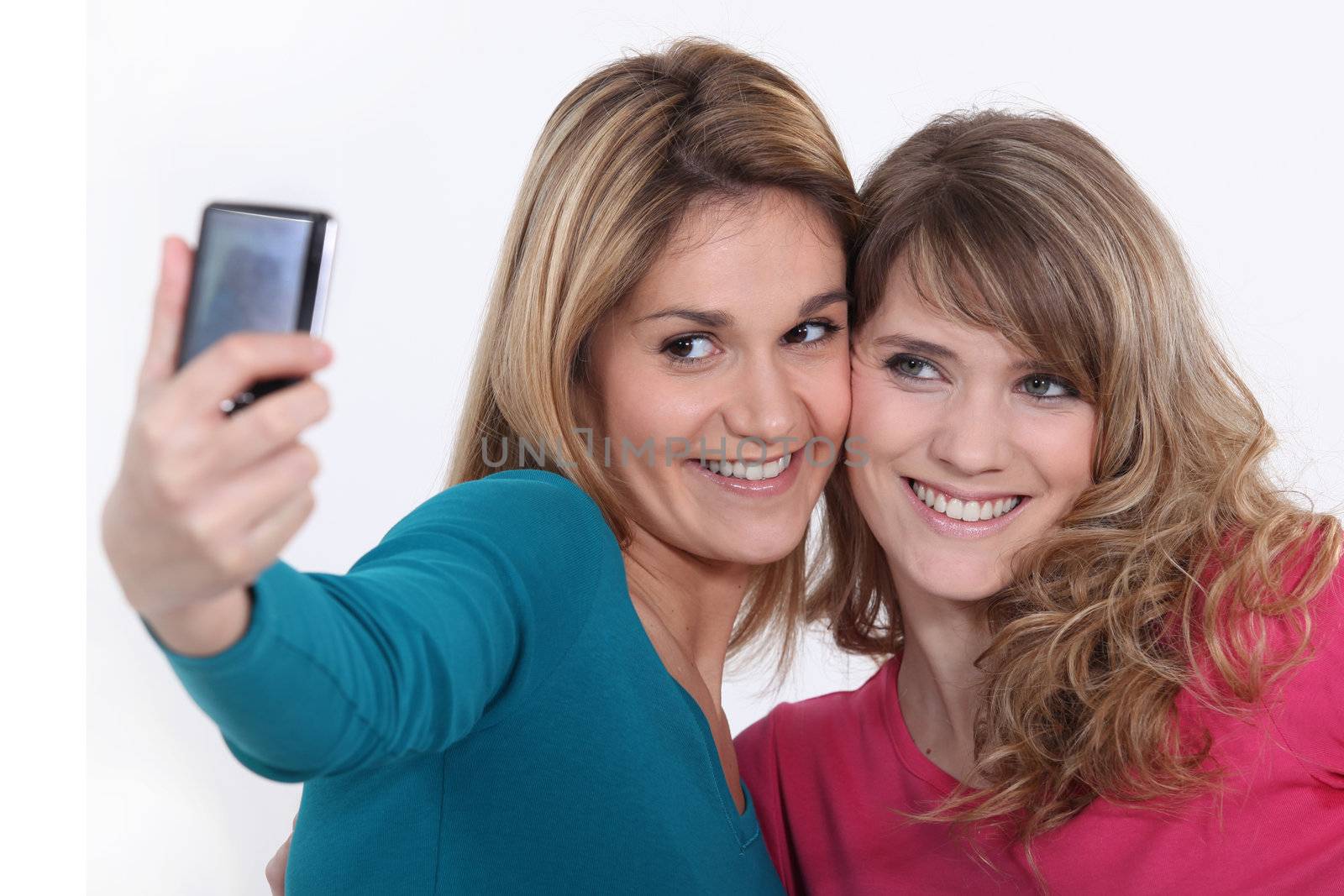 Two girls taking a picture by phovoir
