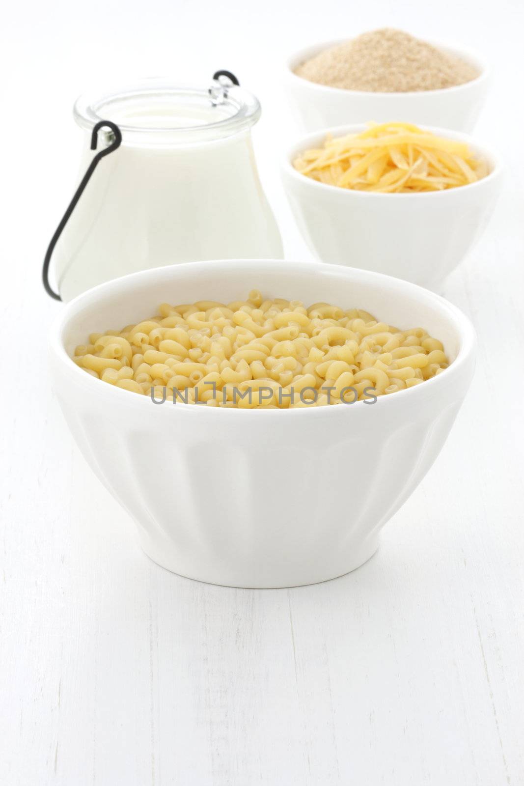 Delicious macaroni and cheese ingredients with a smooth milk cream, fine bread crumbs and aged cheddar cheese. Almost every kid and adult will love it at once. 
