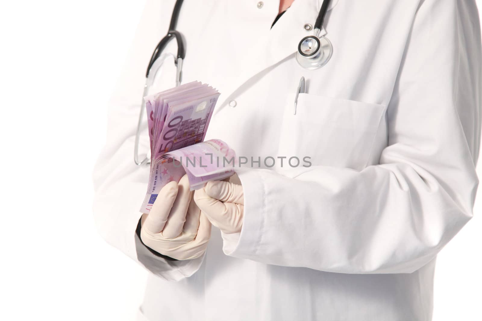 Cropped torso view of the gloved hands of a doctor wearing a labcoat counting a wad of 500 Euro notes isolated on white