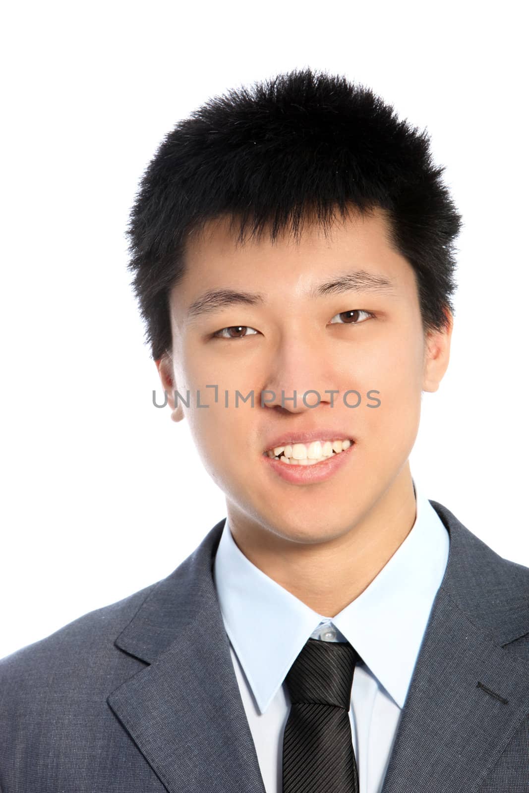 Studio shot of smiling businessman isolated on white