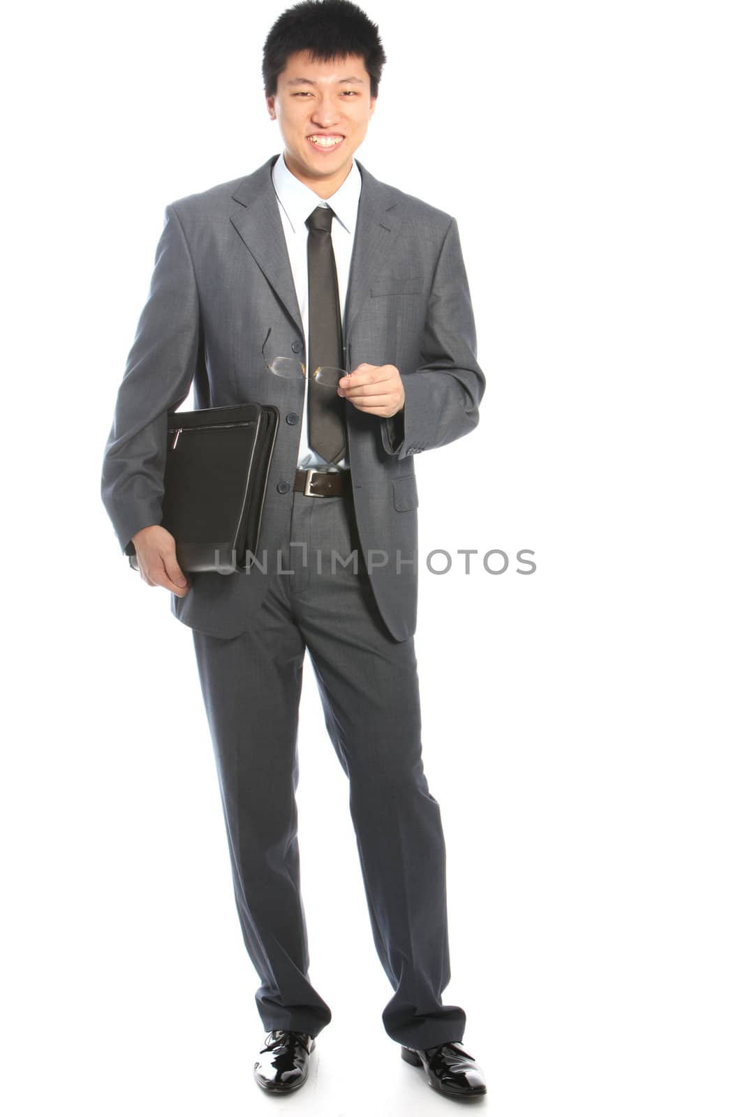 Studio shot of friendly aian businessman on white background