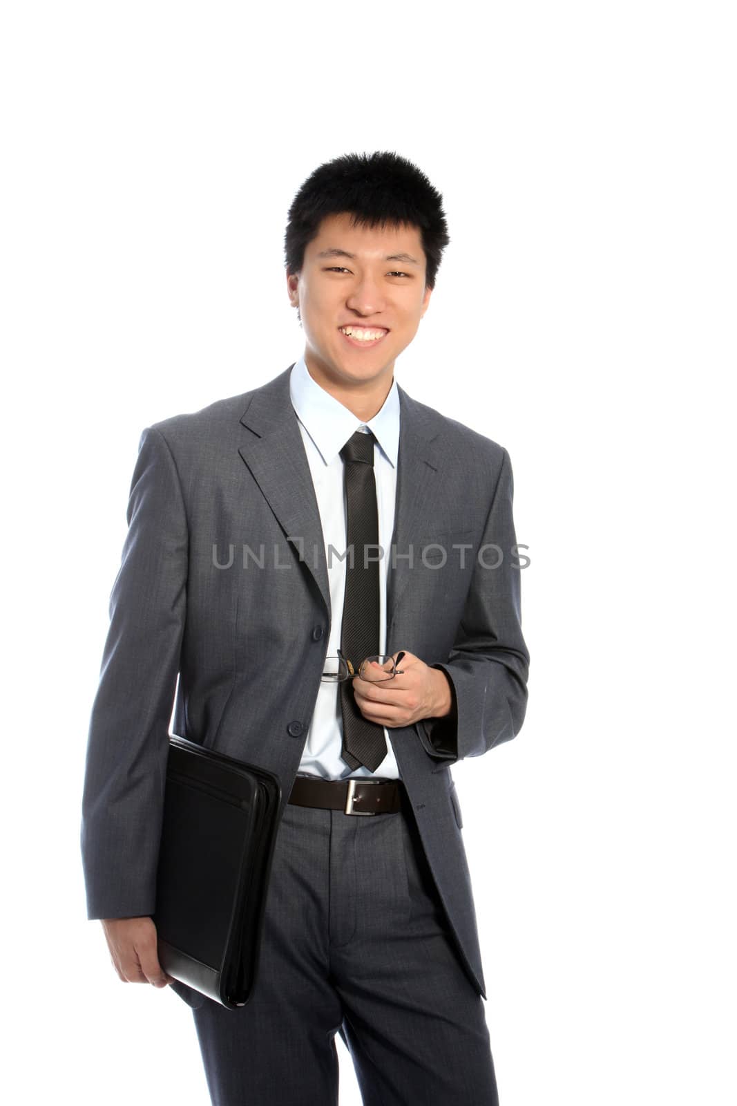 Smiling asian businessman with a tablet case isolated on white