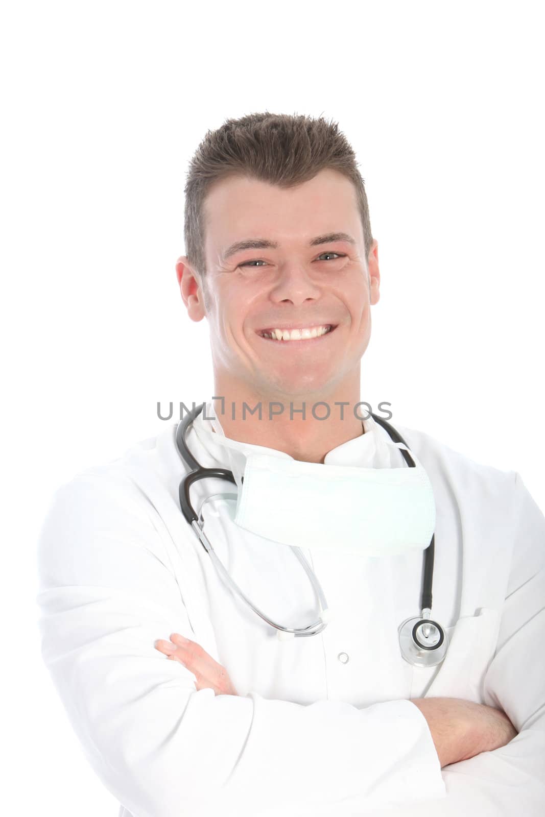 Happy young doctor wearing a stethoscope and posing with folded arms, portrait