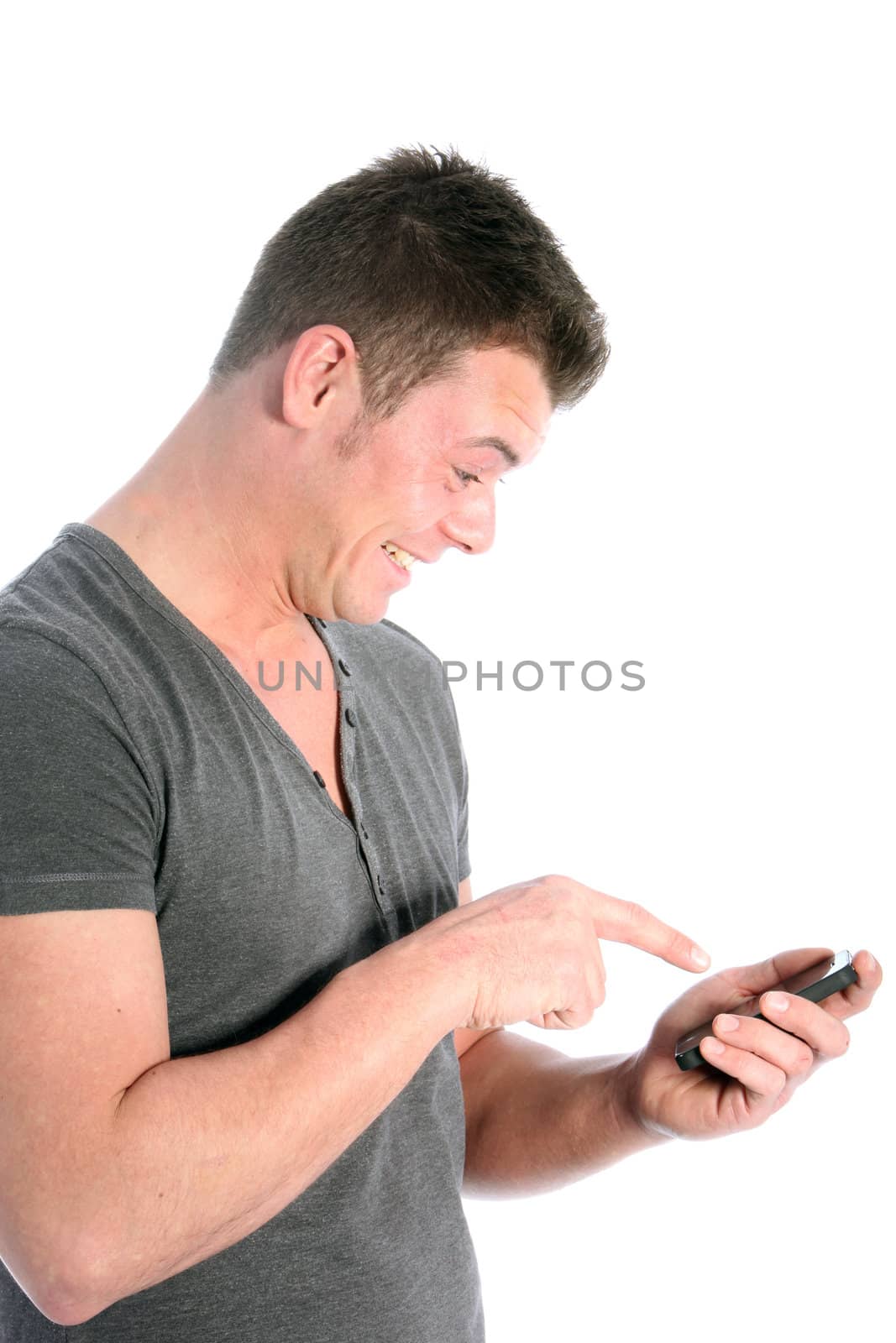 Man pointing at his smartphone in excitement as he reads a message on the screen isolated on white