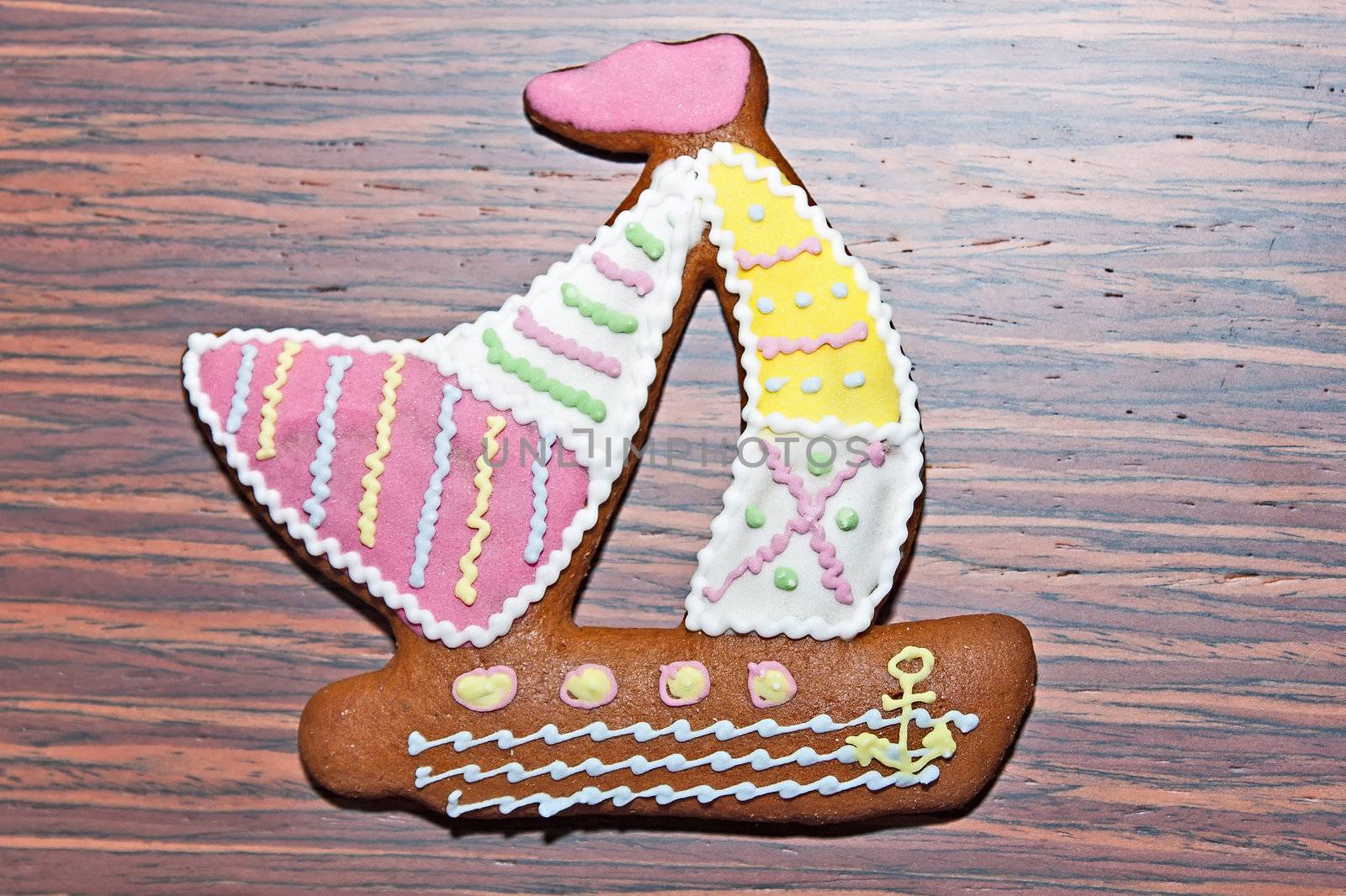 Gingerbread in the form of a fish on a wooden background