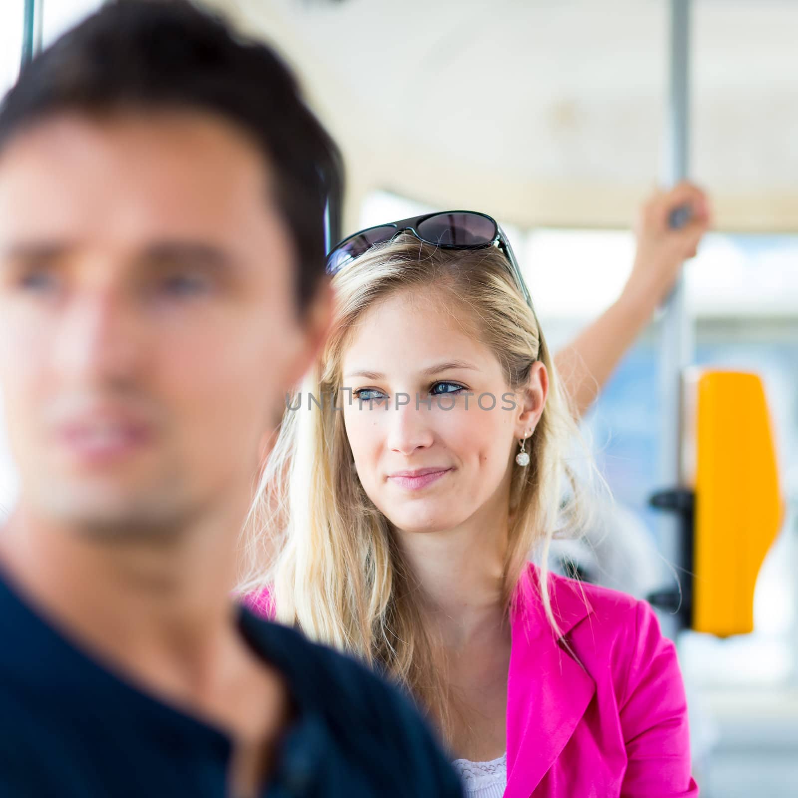 Pretty, young woman on a streetcar/tramway by viktor_cap