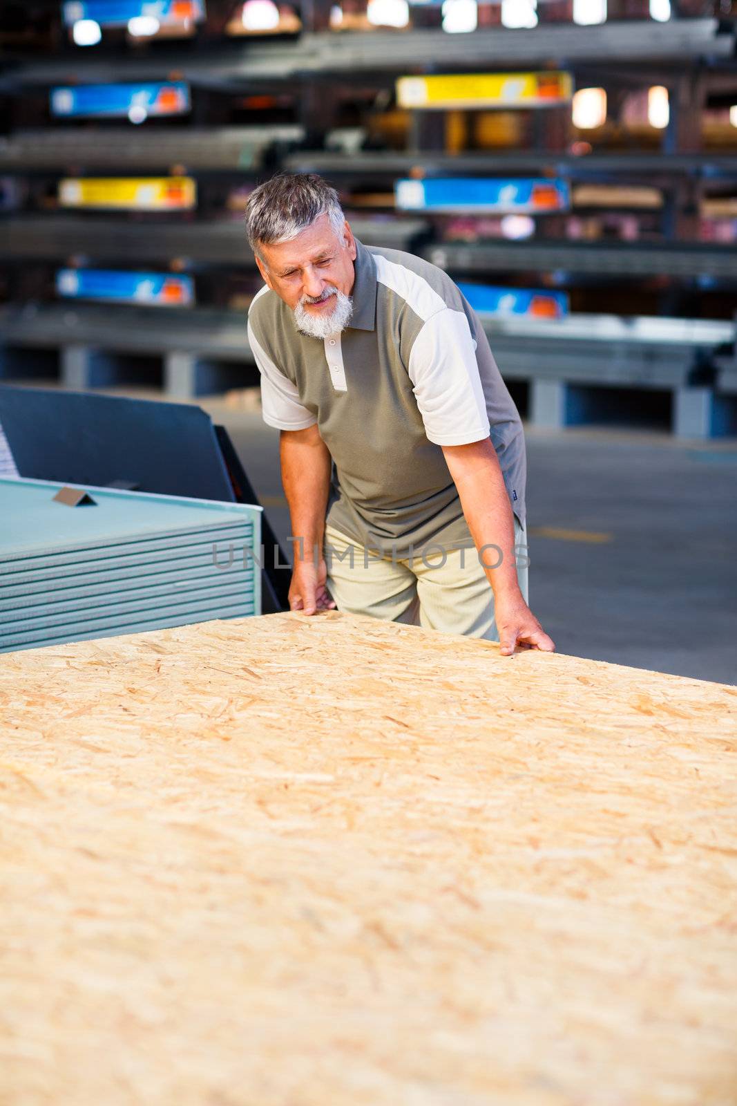 Man buying construction wood in a  DIY store