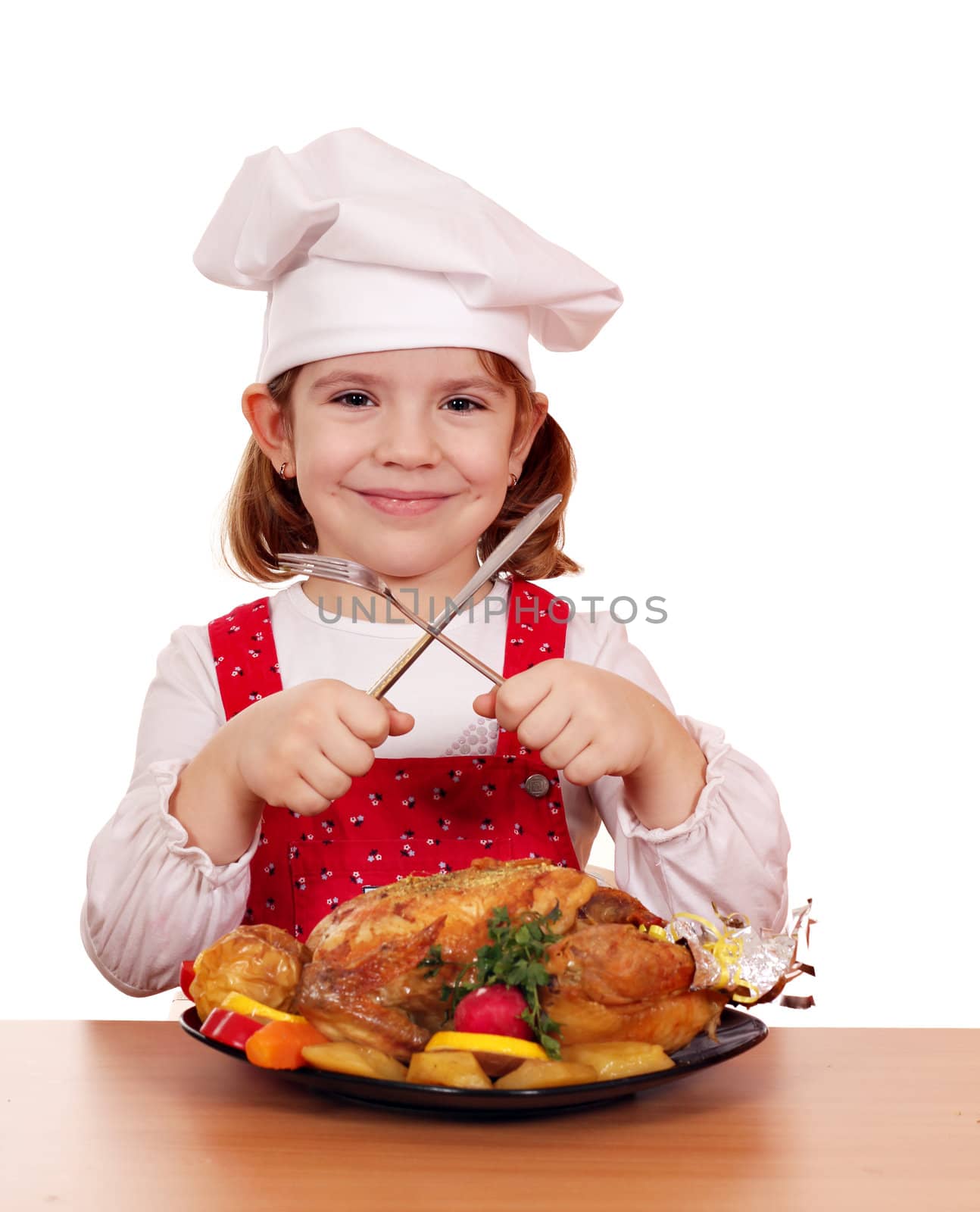 little girl cook with roasted chicken studio shot