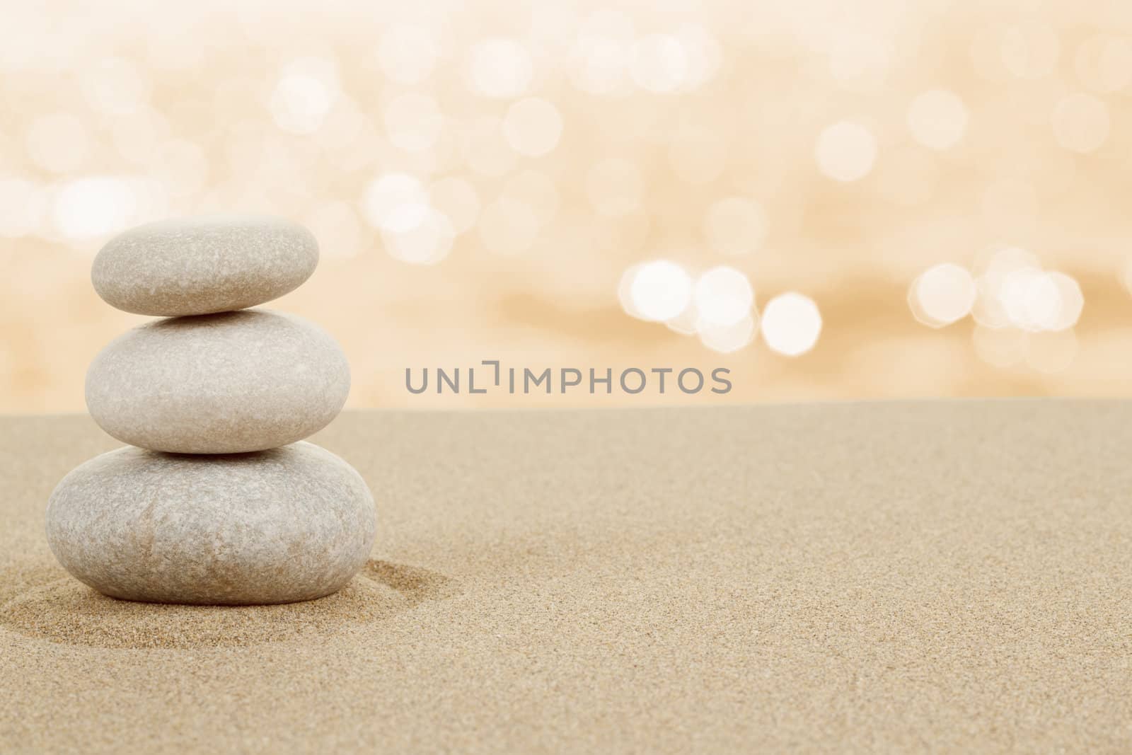 Balance zen stones in sand on white background