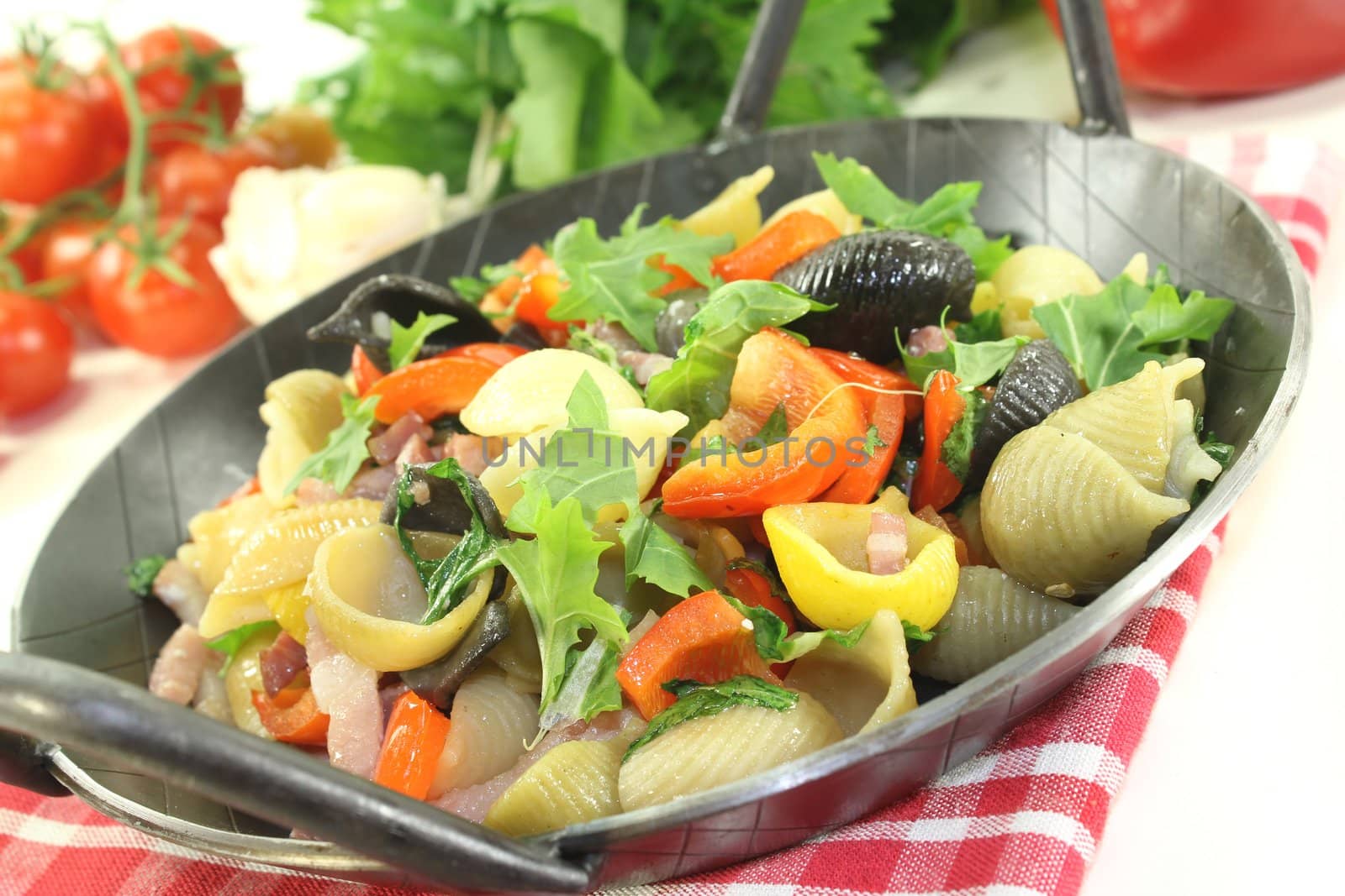 Pasta pan with bell pepper, turnip greens, ham strips, tomatoes and garlic