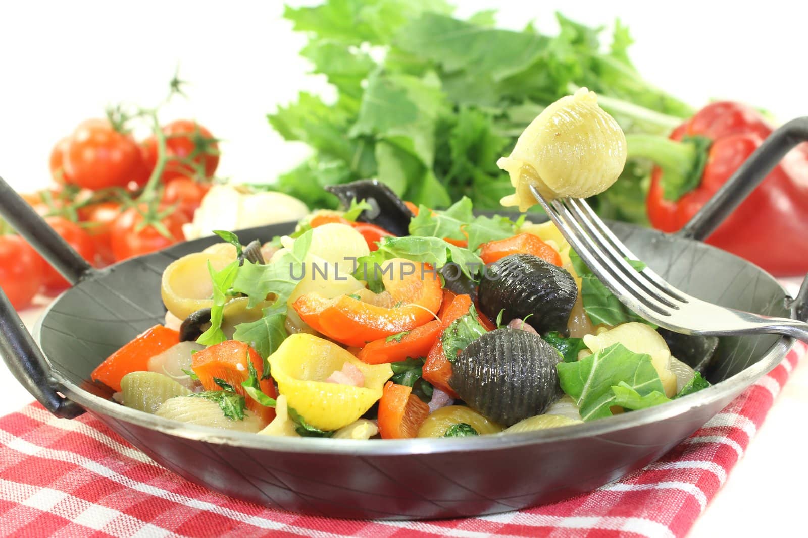 fresh Pasta pan with bell pepper, turnip greens, ham strips, tomatoes and garlic