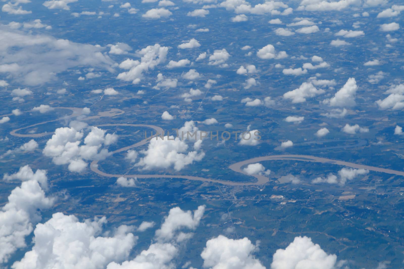 Aerial view of peaceful earth covered in clouds by rufous