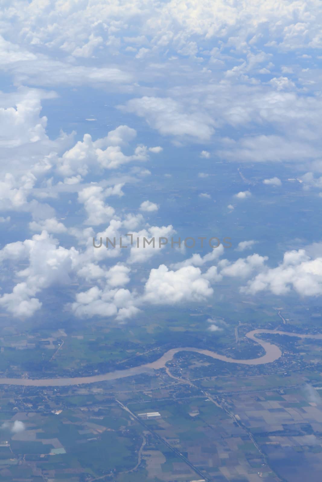 Aerial view of peaceful earth covered in clouds by rufous