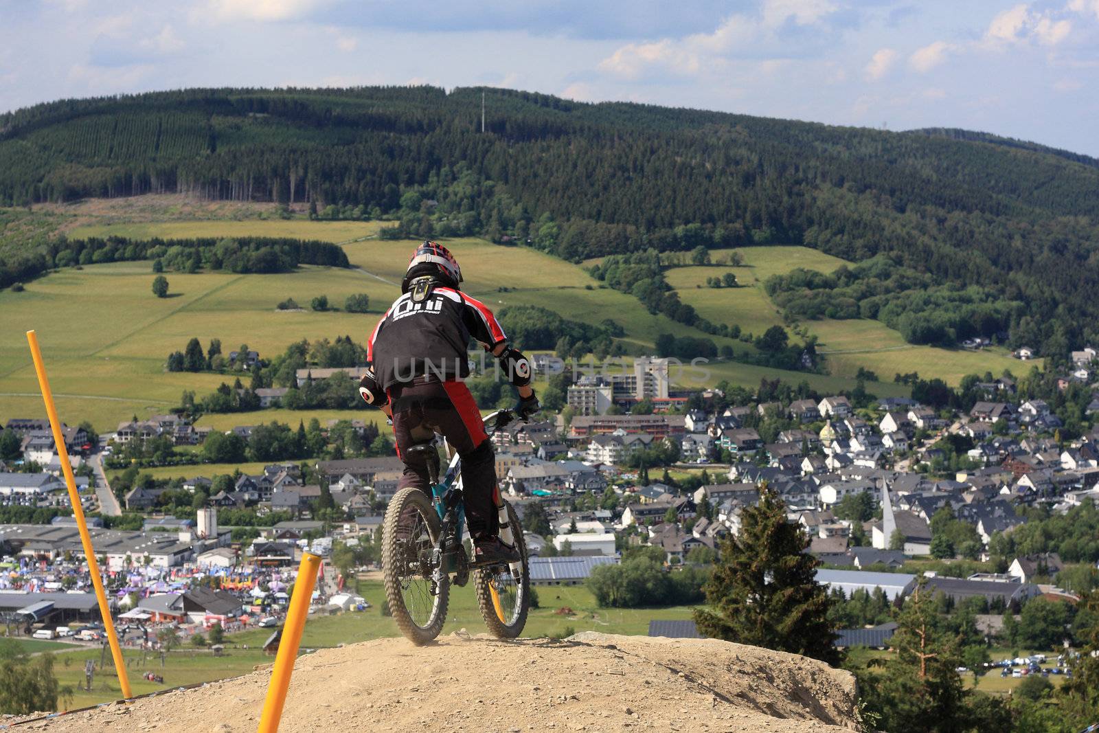 WILLINGEN, GER - JUNE 17, unknown competitor , racing at downhill qualification,Willingen in the background, Willingen, Germany, June 17, 2011