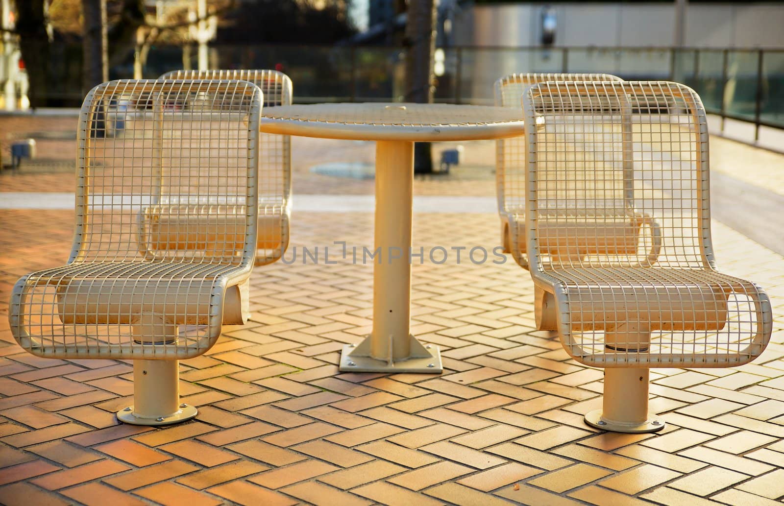 Tan color City Metal Picnic Seats all pointed toward viewer
