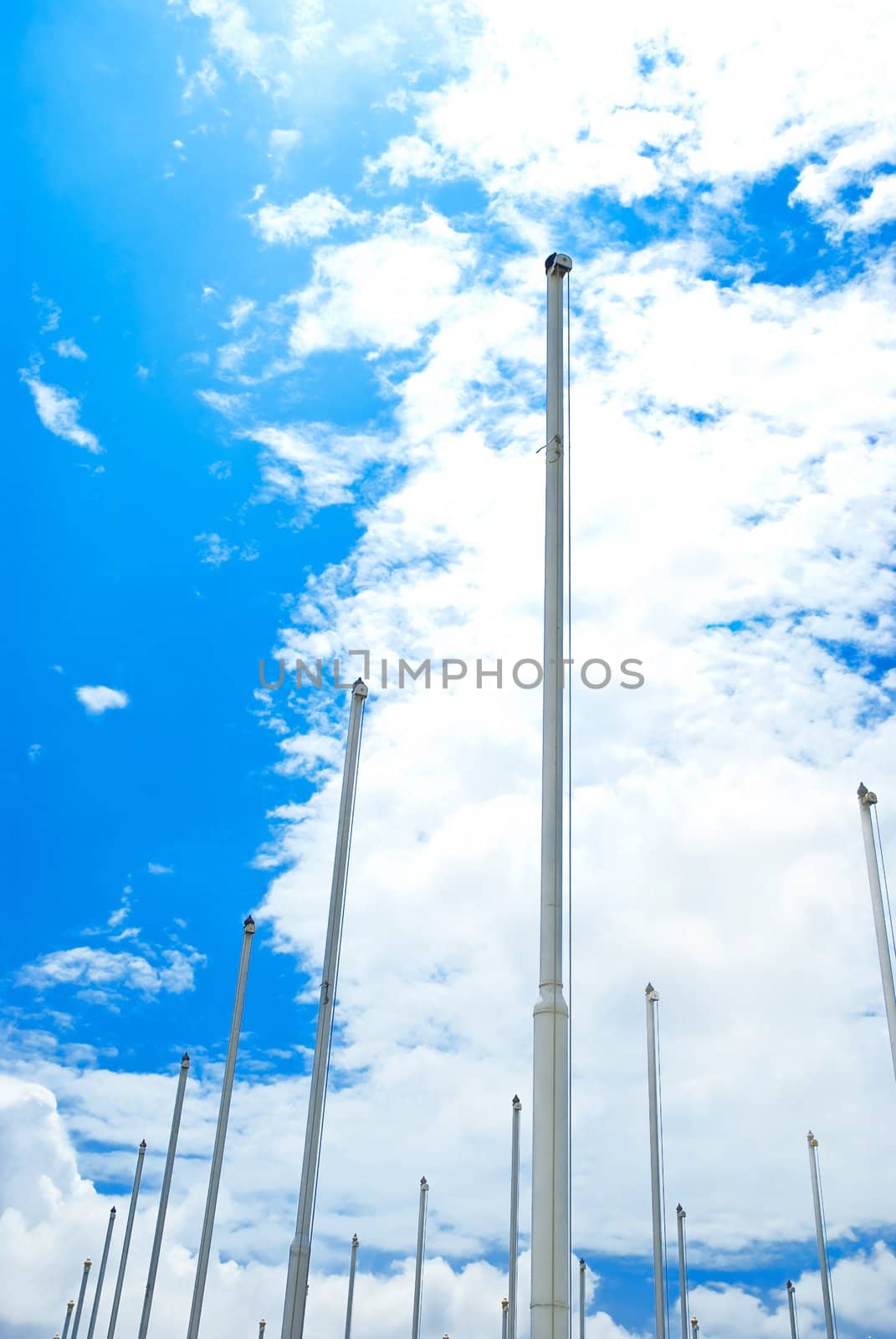 Row of flagpoles by ponsulak