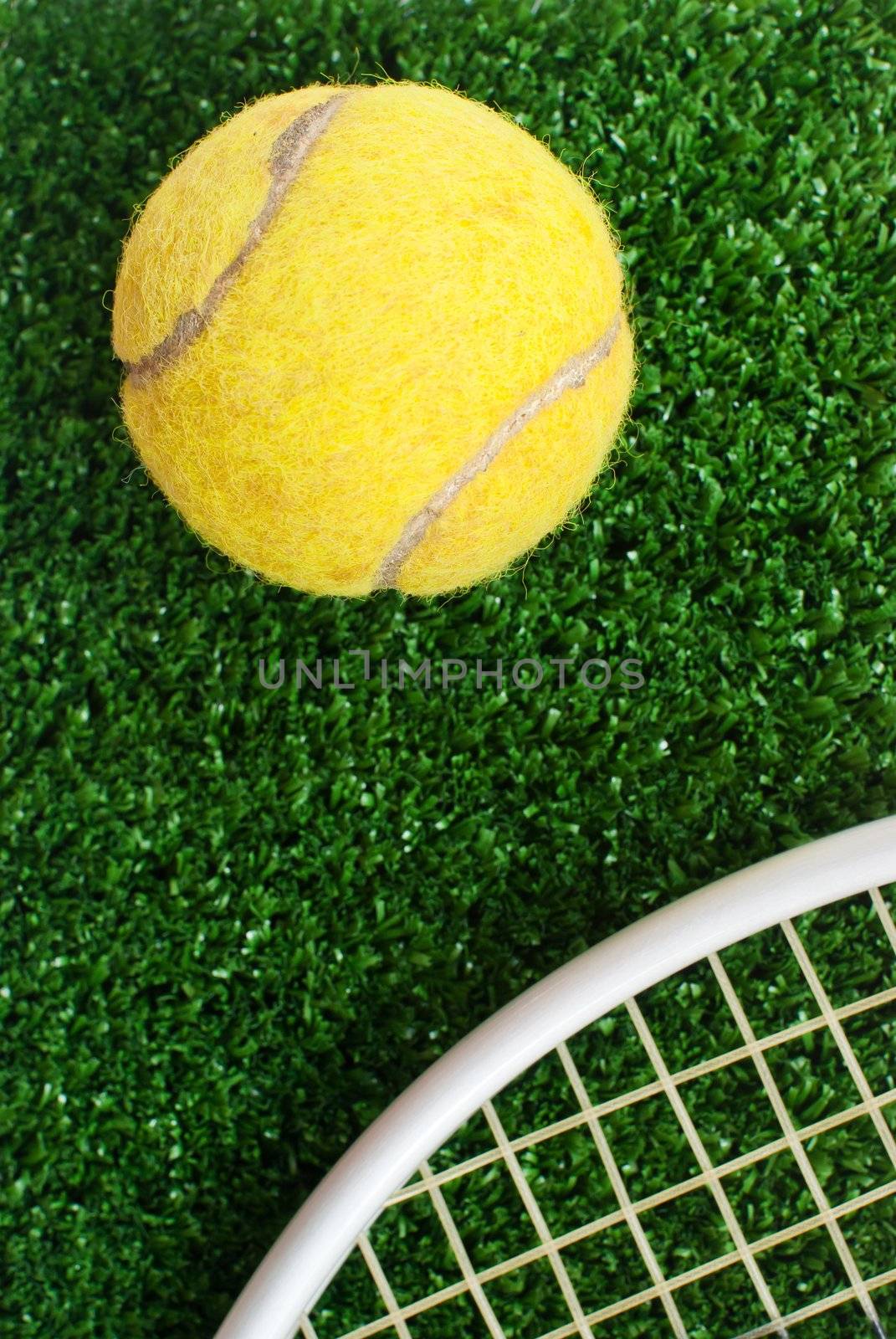 tennis ball on court by ponsulak