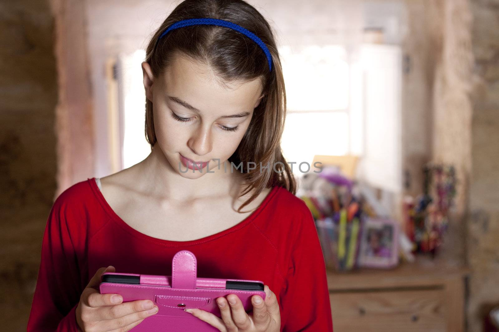 Girl holding tablet by annems