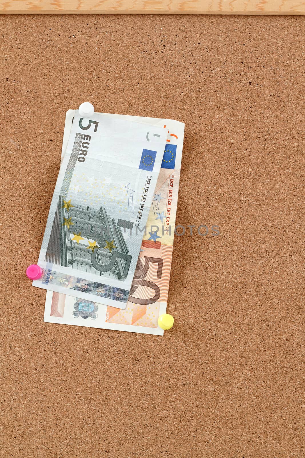closeup of Euro moneys concept on cork board